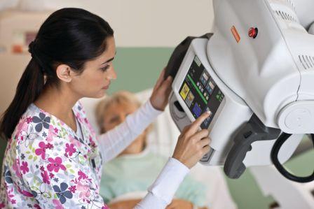 Image of radiologist providing a bedside imaging exam with the DRX Revolution 