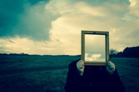 A man holding a mirror