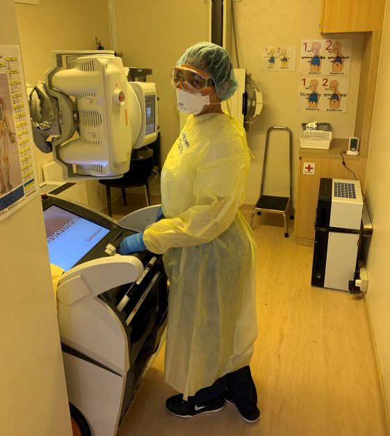 Photo of radiographer using the DRX-Revolution. 